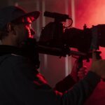 man-filming-with-professional-camera
